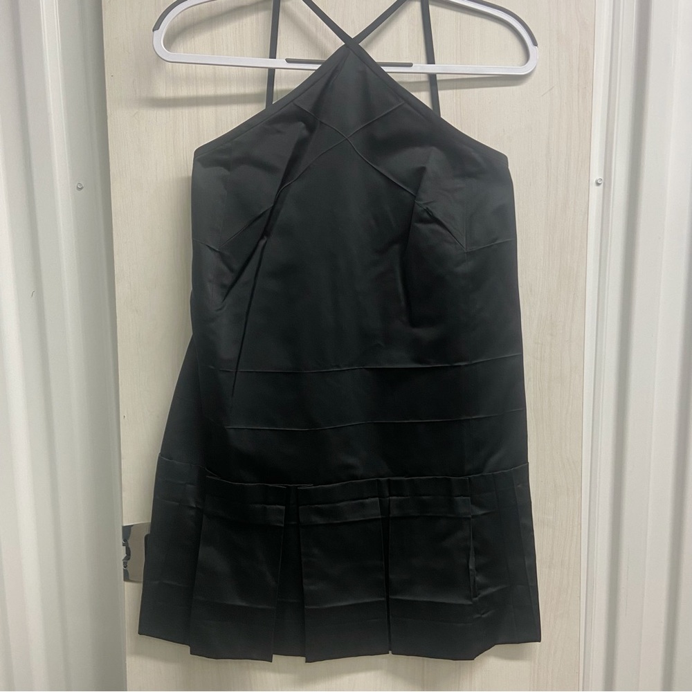 Marc Jacobs black mini dress with pleated ruffle detail.